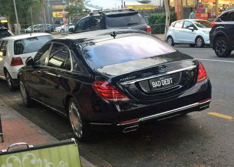 'BAD DEBT' on a Mercedes-Maybach S600.