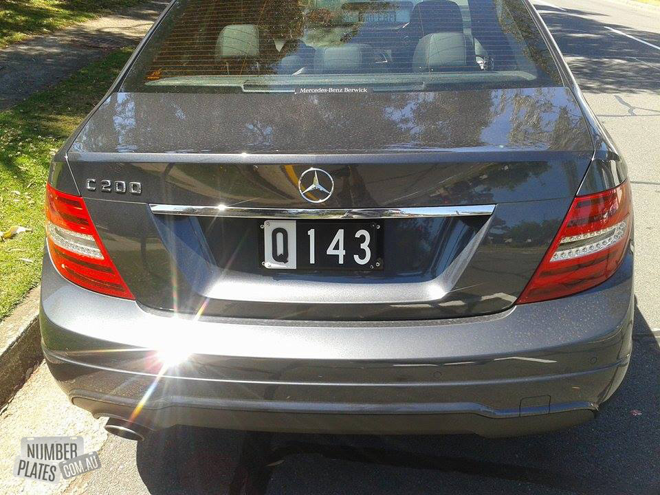 'Q143' on a Mercedes C200.